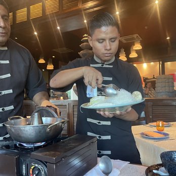 Gong - Angel and Christian prepping our broth, adding veggies in stages. Wagyu beef was left for us to add. - Asian Fusion Near Me - Playa del Carmen, ROO Gong - Angel and Christian prepping our broth, adding veggies in stages. Wagyu beef was left for us to add. - Asian Fusion Near Me - Playa del Carmen, ROO