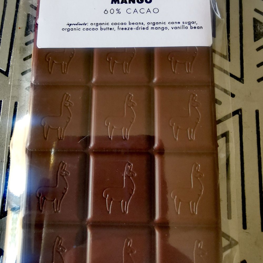 Stone Grindz Chocolate - Made with 50/59 blend of cacao from Ecuador and Peru, this is 60% dark chocolate. Includes organic mango which gives it some spicy tones. - Chocolatiers & Shops Near Me - Scottsdale, Arizona