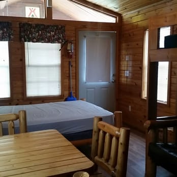 Carlsbad Koa - Inside the yucca cabin. A queen bed with mattress, futon, twin bunk, kitchenette and bathroom. - Campgrounds Near Me - Carlsbad, New Mexico