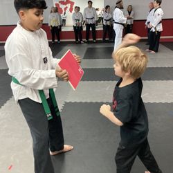 Alpha Team Self Defense - In our Ocala Taekwondo classes, kids and adults learn to use their focus and skills to break boards.