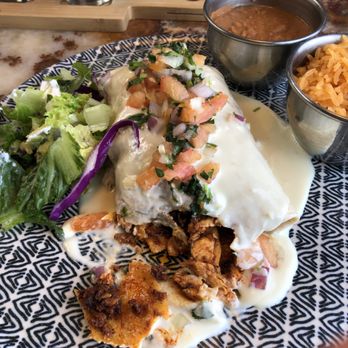 El Barco - One bite missing - Burriti Chori-Pollo with beans and rice on the side rather than inside. Salad from my friends plate. - Seafood Near Me - Staunton, Virginia