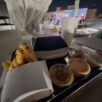 Tesla Diner - All of the sauces and fries with tuna melt in cybertruck box - Diners Near Me - West Hollywood, California Tesla Diner - All of the sauces and fries with tuna melt in cybertruck box - Diners Near Me - West Hollywood, California