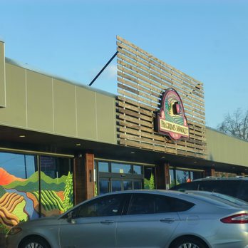 Pilgrim's Market - a car parked in front of the store - Health Markets Near Me - Coeur D'alene, Idaho
