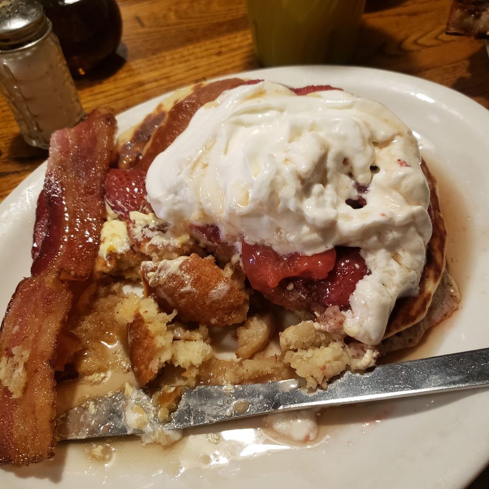 Tin Lizzie Cafe - Pancakes topped with strawberries and whipped cream - Southern Near Me - West Point, Mississippi Tin Lizzie Cafe - Pancakes topped with strawberries and whipped cream - Southern Near Me - West Point, Mississippi