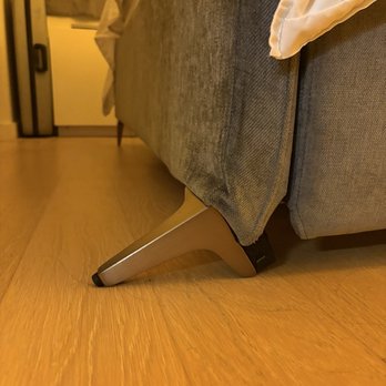 Leather Care - Before -- normal bed leg can be seen in the back, bed leg completely collapsed in front. - Furniture Repair Near Me - Brooklyn, New York Leather Care - Before -- normal bed leg can be seen in the back, bed leg completely collapsed in front. - Furniture Repair Near Me - Brooklyn, New York