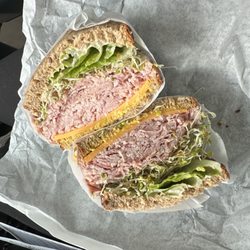 Coffee Culture - Ham and Cheddar sandwich with mustard, mayo, lettuce, and sprouts.