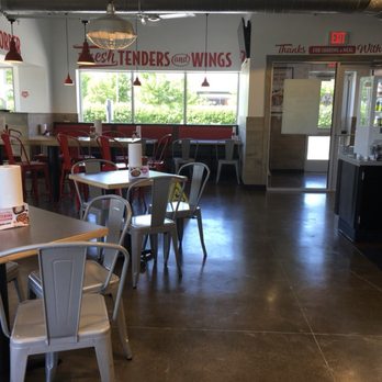 Slim Chickens - Dining area... Caution, floor might be slippery. It wasn't slippery during our visit. - Chicken Wings Near Me - Plainfield, Illinois