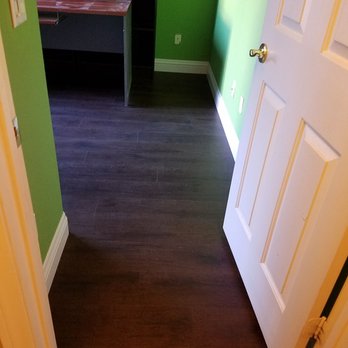 Expert Flooring Solutions - New dark wood look vinyl in the office with new baseboard - Flooring Near Me - Las Vegas, Nevada Expert Flooring Solutions - New dark wood look vinyl in the office with new baseboard - Flooring Near Me - Las Vegas, Nevada