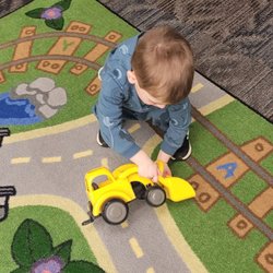 Scott Township Public Library - Playing with a toy truck.