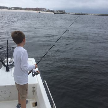 Scallywag Charters - Oaklee reeling in a Spanish Mackerel. - Fishing Near Me - Destin, Florida Scallywag Charters - Oaklee reeling in a Spanish Mackerel. - Fishing Near Me - Destin, Florida
