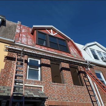 Zicklin Contracting - a brick building with a ladder - General Contractors Near Me - New York, New York