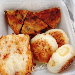 Fried turnip cakes, pan fried buns and green onion pancakes Fried turnip cakes, pan fried buns and green onion pancakes