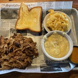 Pulled pork platter, mac & cheese and maybe grits? I didn't order grits. But she's going to bring my dirty rice. Pulled pork platter, mac & cheese and maybe grits? I didn't order grits. But she's going to bring my dirty rice.