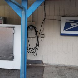 Chevron - The air machine is inconspicuous between the ice freezers and the "Village Post Office" sign.