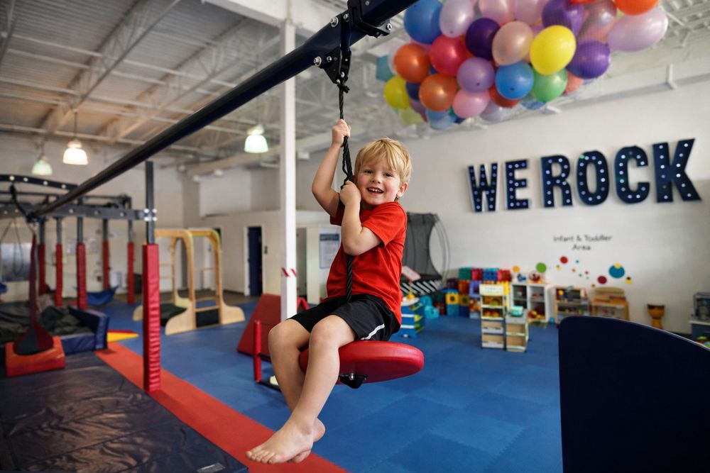We Rock the Spectrum Kids Gym Logo
