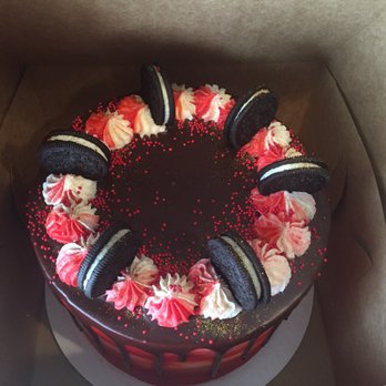 Drip Cake Bar - a chocolate cake with red and white frosting - Custom Cakes Near Me