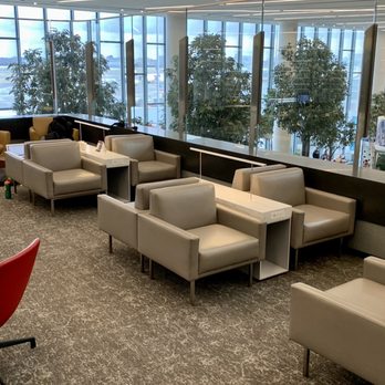 Air Canada Maple Leaf Lounge - Seating area with view over concourse - Airport Lounges Near Me Air Canada Maple Leaf Lounge - Seating area with view over concourse - Airport Lounges Near Me