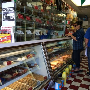 Pastosa Ravioli - a man and a woman in a store - Pasta Shops Near Me - Oceanside, New York