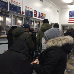 US Post Office - It's 9:00 AM. There's a line already but no one from the Post Office is actually working. They just opened the door.