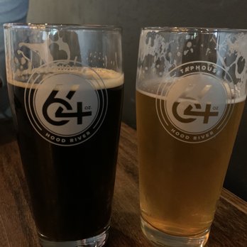 64 Taphouse - two glasses of beer on a table - Bars Near Me - Hood River, Oregon
