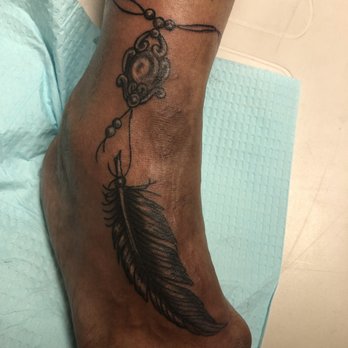 Andy's Pirate Tattoo - My friends feather tatt... - Tattoo Near Me - Panama City, Florida