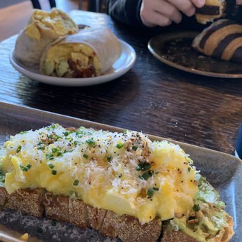 The Henry - Smashed Avocado Toast, California Breakfast Burrito, and a chocolate crossiant. - New American Near Me - Phoenix, Arizona The Henry - Smashed Avocado Toast, California Breakfast Burrito, and a chocolate crossiant. - New American Near Me - Phoenix, Arizona
