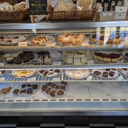 Sweet Times - Dessert case, bread loaves and rolls for sale, too