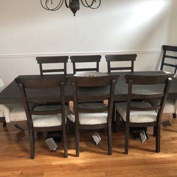Ashley Store + Outlet - Table with 8 chair 2 are pushed to the corners - Furniture Stores Near Me - Poughkeepsie, New York