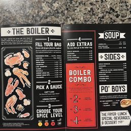 The menu from The Boiler restaurant displays various seafood dishes, including crab, lobster, shrimp, and crawfish, with options to choose sauces and spice levels. It also offers side dishes such as garlic noodles, sausage, fries, and more, along with combo meal options with different weight choices. The menu is printed on black paper with white and red accents, and includes prices for each item. The layout is organized into sections for seafood, sides, and combo meals.