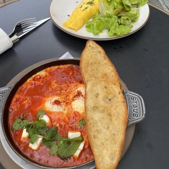 Le Bon Nosh - Shakshouka with omelet in the background - Cafes Near Me - Atlanta, Georgia Le Bon Nosh - Shakshouka with omelet in the background - Cafes Near Me - Atlanta, Georgia