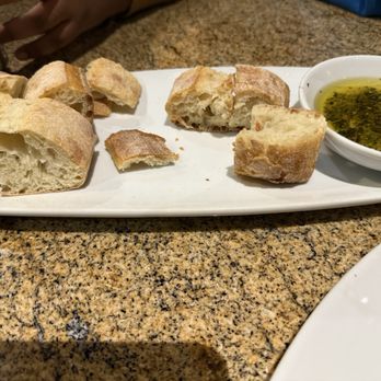 California Pizza Kitchen - Bread and herb oil dip - Pizza Near Me - Scottsdale, Arizona California Pizza Kitchen - Bread and herb oil dip - Pizza Near Me - Scottsdale, Arizona