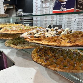 Krave It Pizza & Sandwich Joint - Loaded Tater Tot pie on the bottom right, Fried Oreo pizza top middle. - Sandwiches Near Me - Bayside, New York