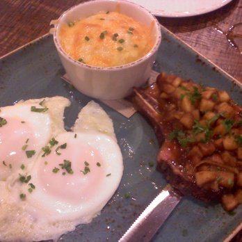 First Watch - Heritage pork chop and eggs. Cheddar grits! Apple compote! Pork chop that tastes like savory ham! - Breakfast & Brunch Near Me - Tucson, Arizona First Watch - Heritage pork chop and eggs. Cheddar grits! Apple compote! Pork chop that tastes like savory ham! - Breakfast & Brunch Near Me - Tucson, Arizona