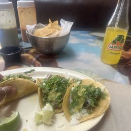 Lengua tacos and pineapple Jarritos