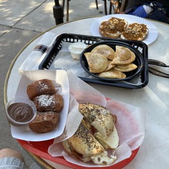 Charmed Kitchen - the Breakfast sandwich on an everything bagel, beignet, special pierogies with honey & Old bay, and the Daybreak toast - Bakeries Near Me - Baltimore, Maryland