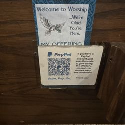 Ascension Catholic Church - Interesting new way of collecting money. I always bring cash and don't particularly agree with having these on the pews.