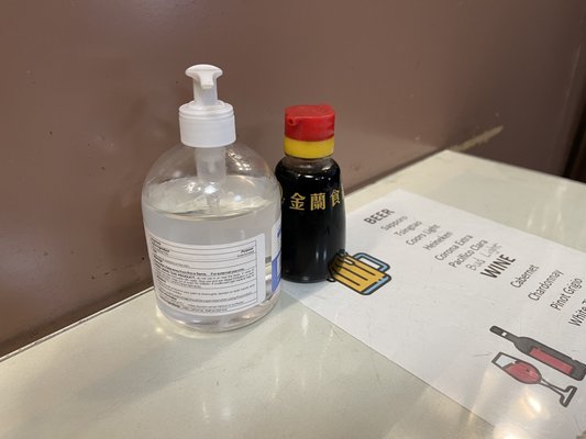 Photo of La China Restaurant - El Cajon, CA, US. Table condiments include a delicious array of soy sauce and hand sanitizer