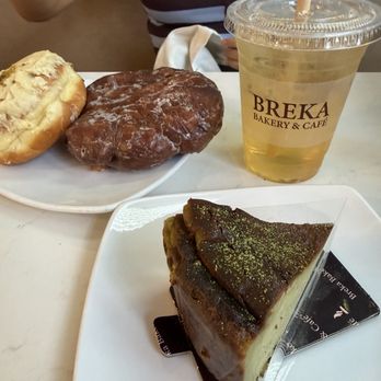Breka Bakery & Cafe - Matcha Basque Cheesecake, Apple Fritter, Pistachio Filled Donut, Peach Oolong Tea - Bakeries Near Me - Vancouver, British Columbia Breka Bakery & Cafe - Matcha Basque Cheesecake, Apple Fritter, Pistachio Filled Donut, Peach Oolong Tea - Bakeries Near Me - Vancouver, British Columbia