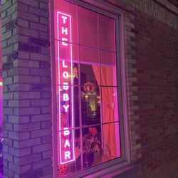 The Lobby Bar - Window sign at night