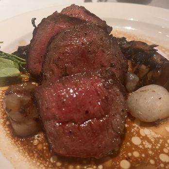 The Capital Grille - Sliced Filet Mignon with Cipollini Onions, Wild Mushrooms and Fig Essence - Steakhouses Near Me - Tampa, Florida The Capital Grille - Sliced Filet Mignon with Cipollini Onions, Wild Mushrooms and Fig Essence - Steakhouses Near Me - Tampa, Florida