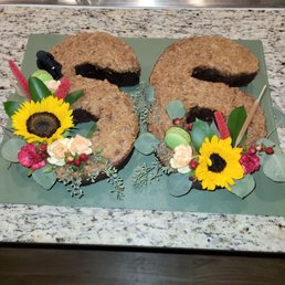 My husband ordered this beautiful cake for my birthday.  She even made a model of our standard poodle. The cake was delicious.