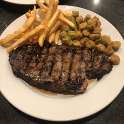 Sundowner Bar & Grill - Ribeye steak with French fries and fried okra.