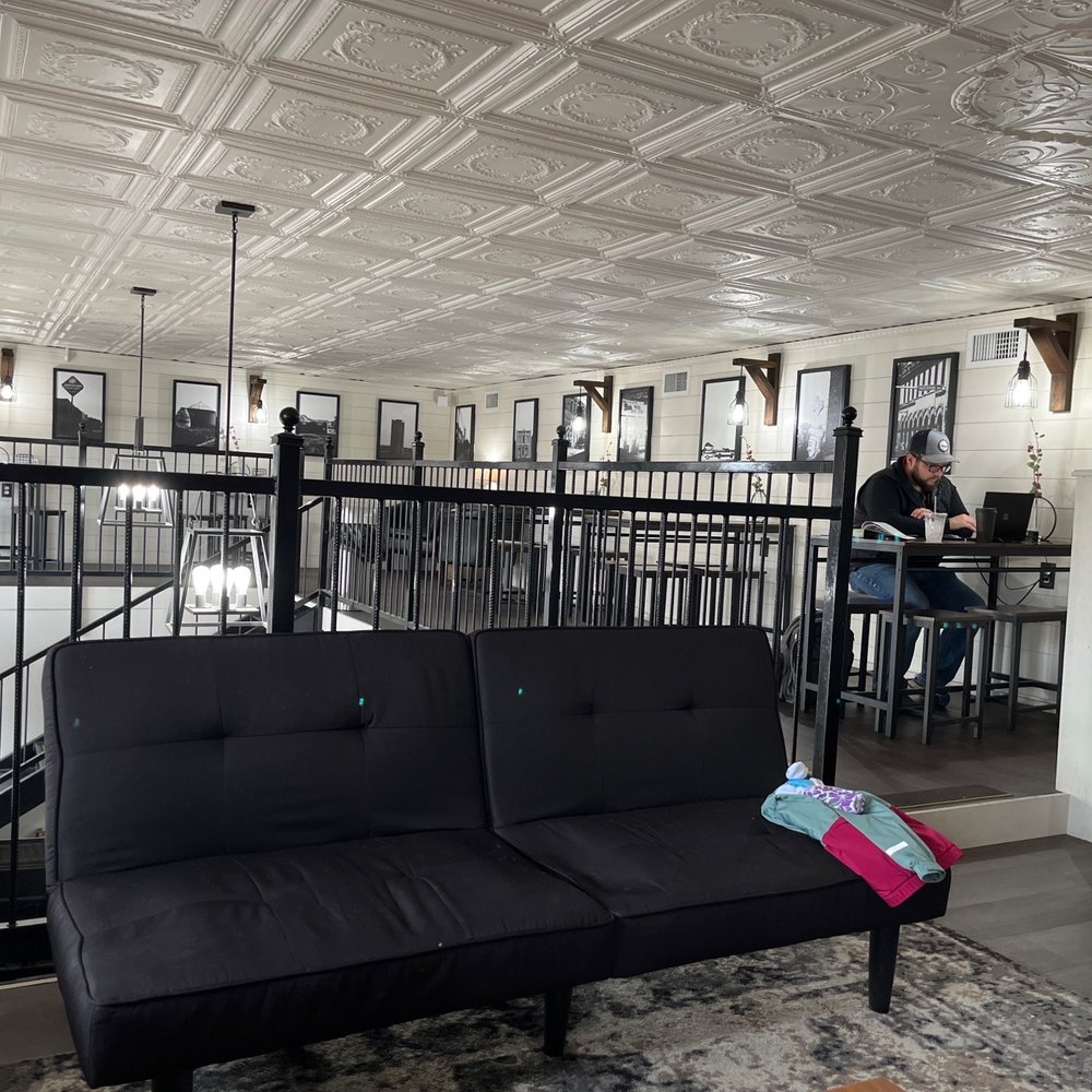 The Coffee Haus On Main - a black couch in the middle of the room - Coffee Roasteries Near Me - Ballinger, Texas The Coffee Haus On Main - a black couch in the middle of the room - Coffee Roasteries Near Me - Ballinger, Texas