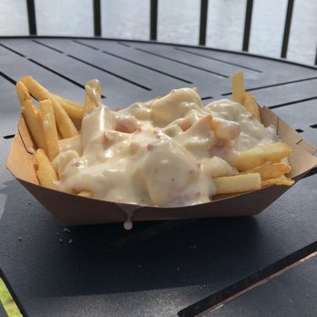 La Poutinerie--New! - Poutine Fries covered in cheese curds and cheddar cheese soup! Excellent way to begin the World Showcase in Epcot! - New American Near Me - Orlando, Florida