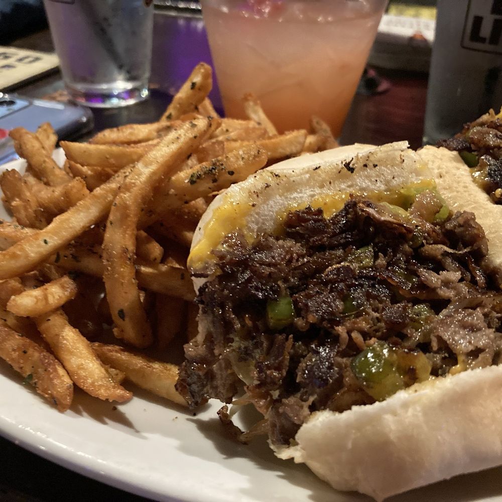 Cheesesteak w shoestring fries - both items seasoned to perfection