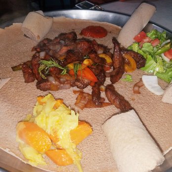 Addis Restaurant - This is a dry version of beef tibs. Very very flavorful! And that's cabbage, potato and carrot on the side! - Ethiopian Near Me - Columbus, Ohio Addis Restaurant - This is a dry version of beef tibs. Very very flavorful! And that's cabbage, potato and carrot on the side! - Ethiopian Near Me - Columbus, Ohio