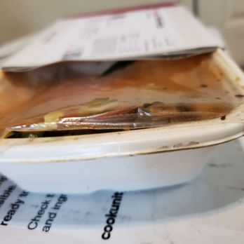 Cook Unity - an open container of food sitting on top of a microwave - Food Delivery Services Near Me