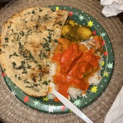 Great Cuisine of India - Naan, butter and tikka masala chicken and masala Gobi