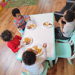 Preschool learns how to sit, eat, and use proper manners at the table.