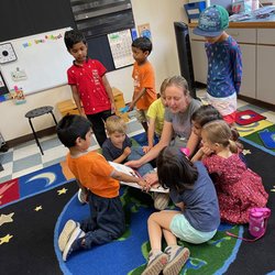 Sammamish Hills Lutheran Preschool - Ms. Julia reading with the Maples class